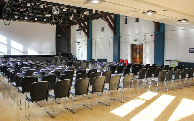 A photo of Debating Hall with chairs set up