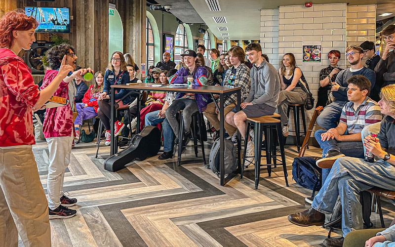 An activation in Joes Bar with students