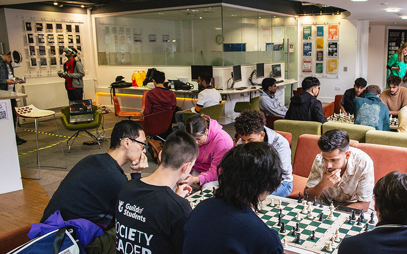 A photo of students sitting in the Guild Reception area