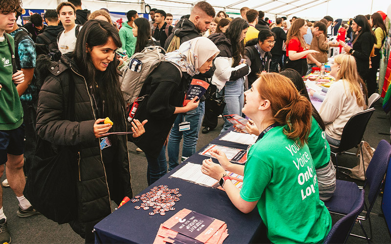 a photo of student staff at Welcome Fair