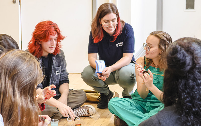 a photo of student staff leading a group session