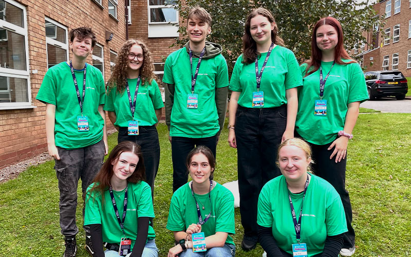 a photo of a student staff outside