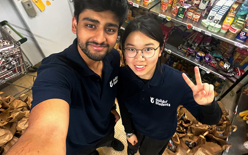 a photo of a student staff members working in community pantry
